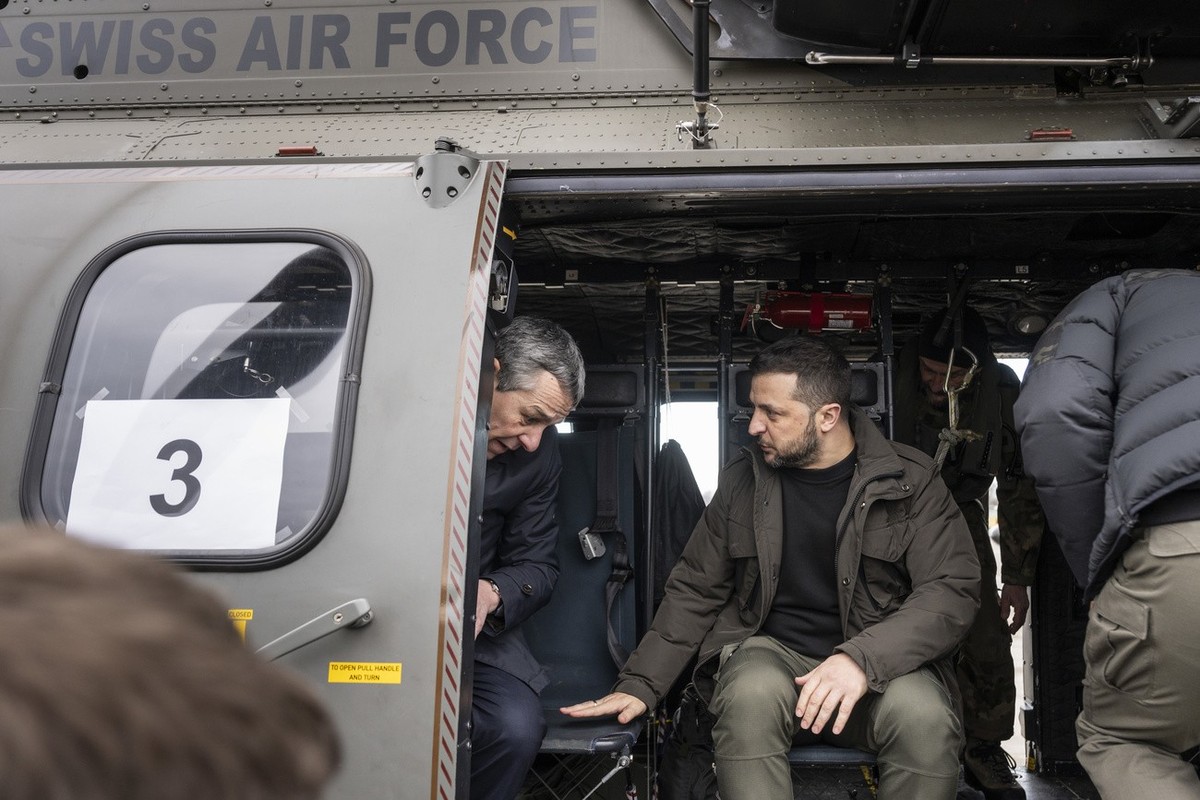 Switzerland's Foreign Minister Federal Councillor Ignazio Cassis, left, and his State guest Volodymyr Zelenskyy, President of Ukraine, right, get ready for takeoff in a Super Puma Helicopter of t ...