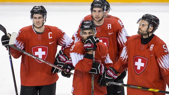 Raphael Diaz of Switzerland, Thomas Ruefenacht of Switzerland, Simon Moser of Switzerland, Leonardo Genoni, goalkeeper of Switzerland, and Philippe Furrer of Switzerland, from left, during the men ice ...