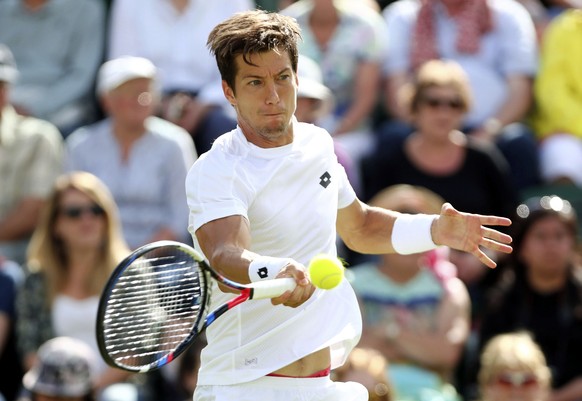 Britain&#039;s Aljaz Bedene returns a ball to Croatia&#039;s Ivo Karlovic during their Men&#039;s Singles Match on day one at the Wimbledon Tennis Championships in London Monday, July 3, 2017. (Gareth ...