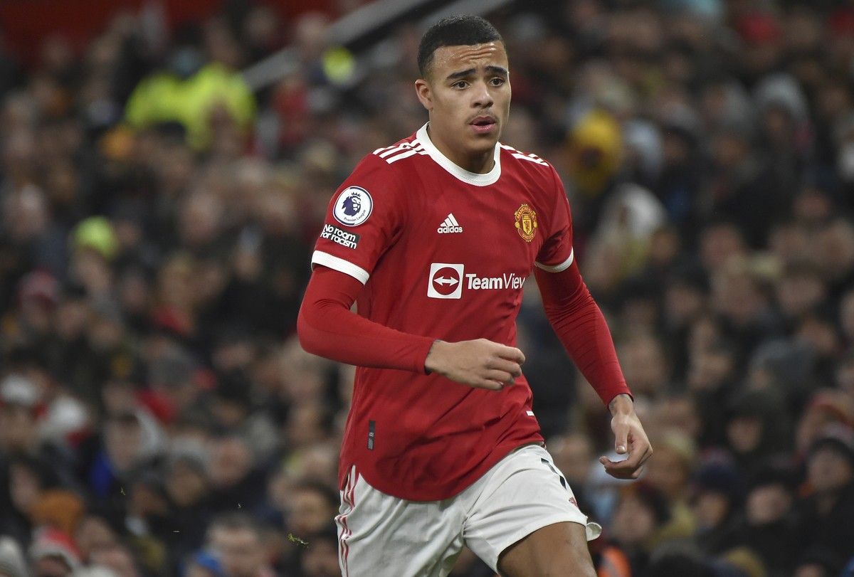FILE- Manchester United's Mason Greenwood runs during the English Premier League soccer match between Manchester United and Burnley at Old Trafford in Manchester, England, Thursday, Dec. 30, 2021 ...