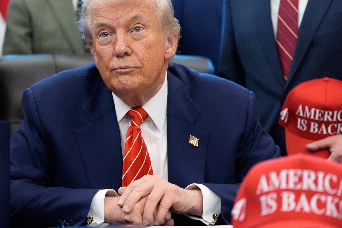 President Donald Trump speaks to reporters after signing a spending bill that ends a partial shutdown of the federal government in the Oval Office of the White House, Tuesday, Feb. 3, 2026, in Washing ...