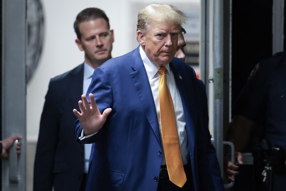 epa11325023 Republican presidential candidate and former US President Donald Trump returns to the courtroom following a break in his hush money trial at the Supreme Court of the State of New York, in  ...