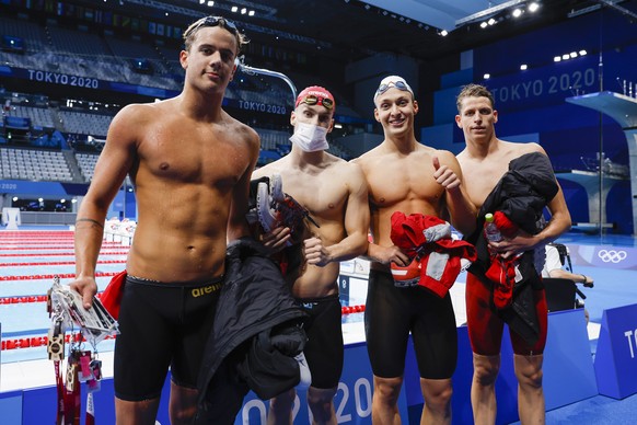epa09365683 (L-R) Noe Ponti, Roman Mityukov, Antonio Djakovic and Nils Liess of Switzerland walk out after competing in the men&#039;s 4x100m Freestyle Relay Heats during the Swimming events of the To ...