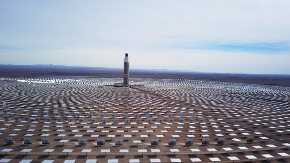 epa09256264 General view of the solar heliostats of the Cerro Dominador solar power plant, in the Antofagasta region, north of Santiago, Chile, 08 June 2021. About 10,600 heliostats (mirrors), 392,000 ...