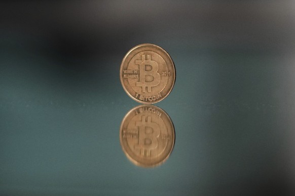 A one bitcoin token reflects as it is placed on a mirror in Prague, Czech Republic, Sunday, May 11, 2025. (AP Photo/Petr David Josek)
Czech Republic Bitcoin