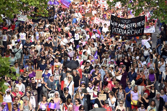 epa07648254 Women take part in a nationwide women's strike in Zurich, Switzerland, 14 June 2019. The strike day intends to highlight, among others, unequal wages, pressures on part-time employees, the burden of household work and sexual violence.  EPA/WALTER BIERI