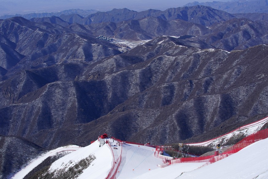 A forerunner tests the alpine skiing downhill course at the 2022 Winter Olympics, Wednesday, Feb. 2, 2022, in the Yanqing district of Beijing. (AP Photo/Robert F. Bukaty)