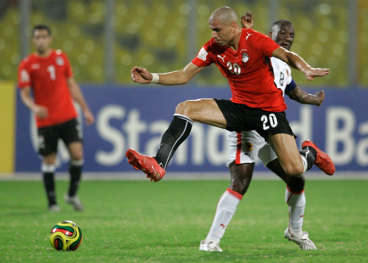 Egypt's Wael Gomaa leaps past Angola's Andre Macanga as he goes for the ball challenges during their African Cup of Nations quarterfinal match in Kumasi, Ghana, Monday, Feb. 4, 2008. Egypt b ...