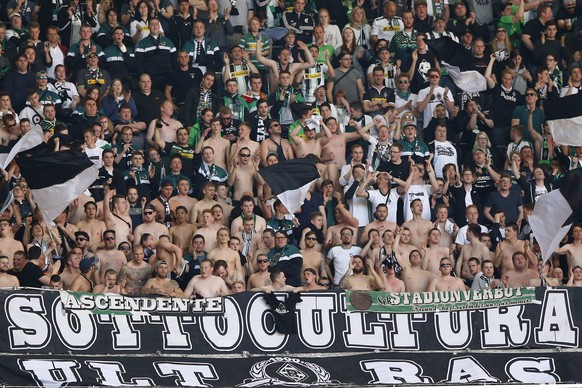 FILE-In this April 30, 2016 file photo Moenchengladbach supporter cheer their team during the German Bundesliga soccer match between FC Bayern Munich and Borussia Moenchengladbach at the Allianz Arena ...