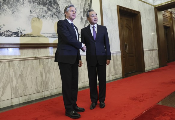 U.S. Secretary of State Antony Blinken, left, shakes hands with China&#039;s top diplomat Wang Yi, right, at the Diaoyutai State Guesthouse in Beijing, China, Monday, June 19, 2023. (Leah Millis/Pool  ...