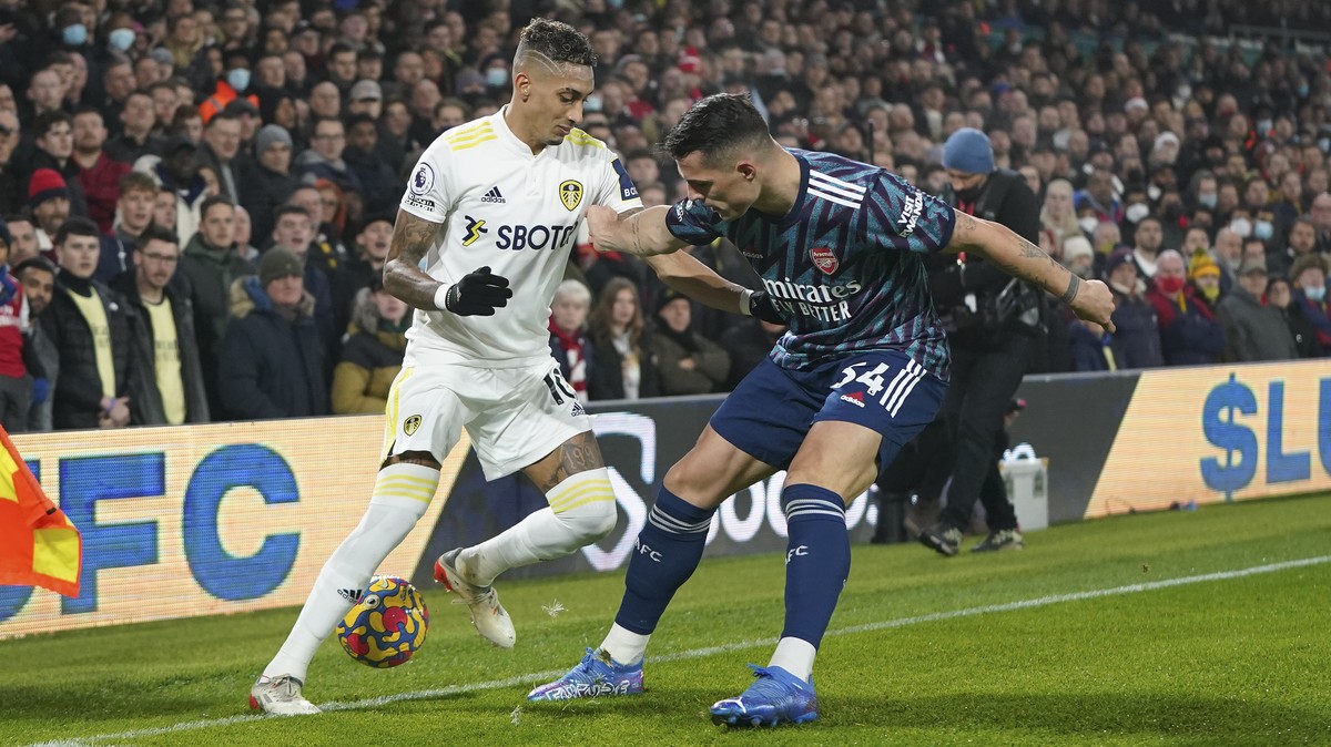 Arsenal's Granit Xhaka, right, challenges Leeds United's Raphinha during the English Premier League soccer match between Leeds United and Arsenal at Elland Road in Leeds, England, Saturday,  ...