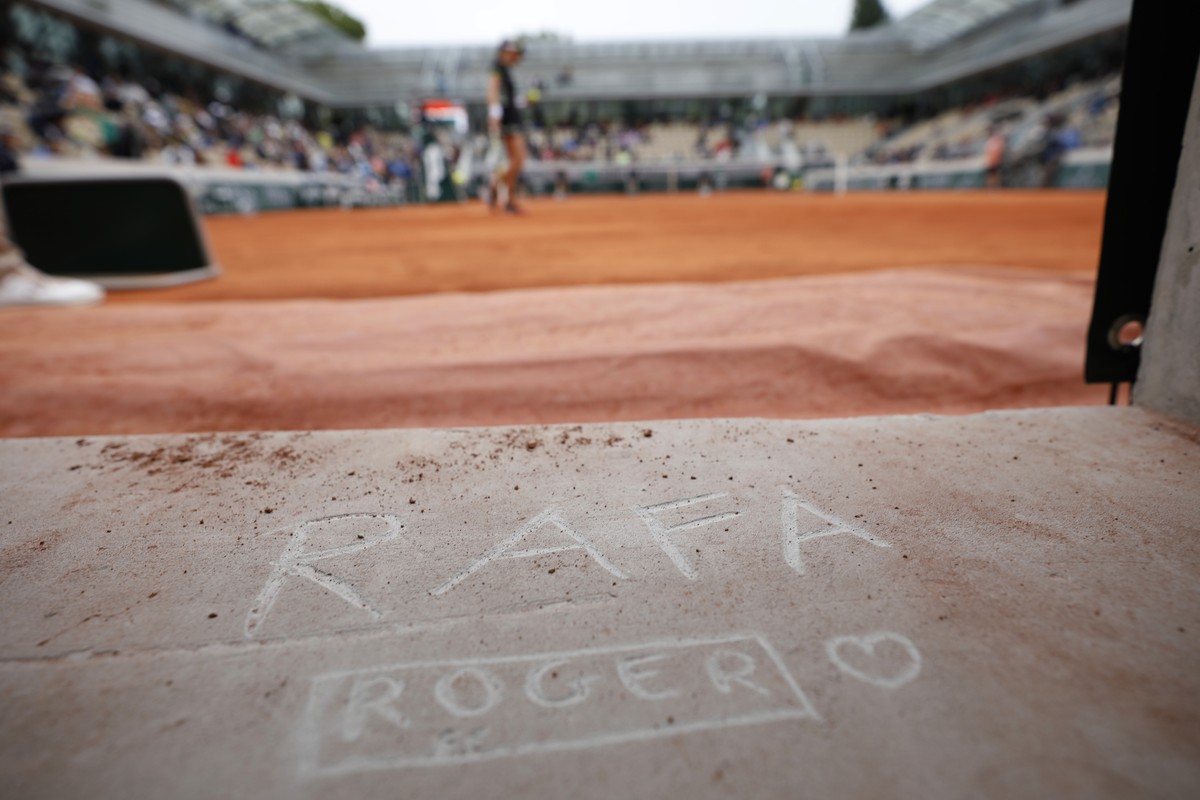 A tennis fan left his marks "RAFA" for Spain's Rafael Nadal and "ROGER" for Switzerland's Roger Federer on Simonne Mathieu court during a women's semifinal match of  ...