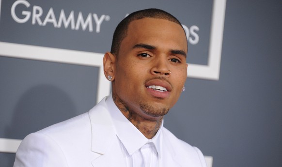FILE - In this Feb. 10, 2013 file photo, Chris Brown arrives at the 55th annual Grammy Awards, in Los Angeles. Brown is no longer in residential rehab. A spokeswoman for the troubled entertainer said  ...