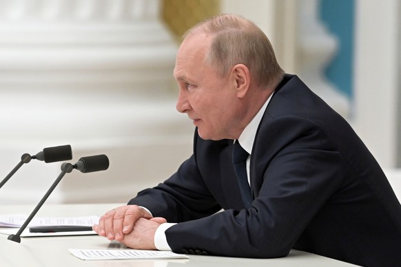 epa09781645 Russian President Vladimir Putin chairs a meeting with Russian businessmen at the Kremlin in Moscow, Russia, 24 February 2022. In the early hours of 24 February, President Putin announced  ...