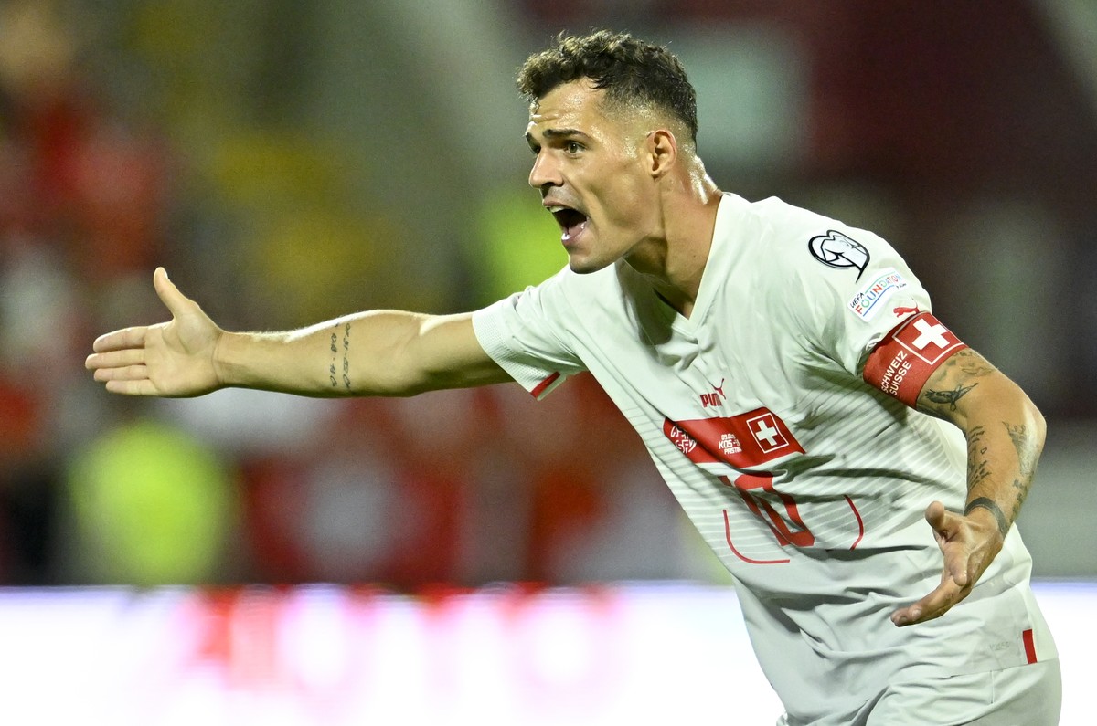 Switzerland's midfielder Granit Xhaka gestures during the UEFA Euro 2024 qualifying group I soccer match between Kosovo and Switzerland at the stadium Fadil Vokrri, in Pristina, Kosovo, Saturday, ...