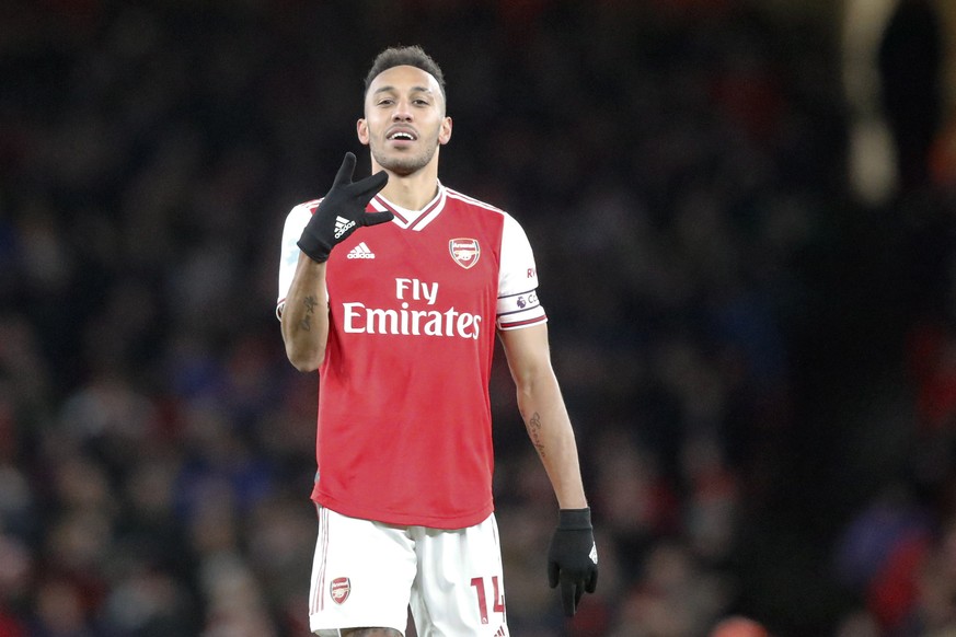 Arsenal's Pierre-Emerick Aubameyang celebrates after scoring his side's first goal during the English Premier League soccer match between Arsenal and Newcastle at the Emirates Stadium in Lon ...