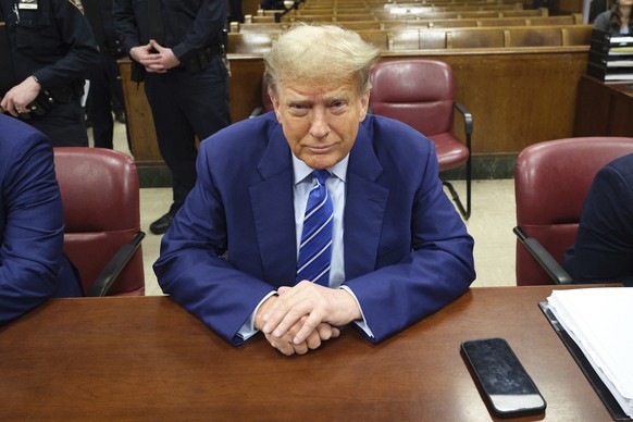 Former President Donald Trump awaits the start of proceedings on the second day of jury selection at Manhattan criminal court, Tuesday, April 16, 2024, in New York. Trump returned to the courtroom Tue ...