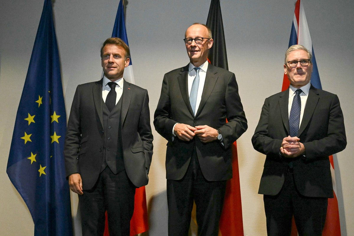 From left, France's President Emmanuel Macron, Germany's Chancellor Friedrich Merz and Britain's Prime Minister Keir Starmer pose as they meet on the sidelines of the two-day NATO' ...
