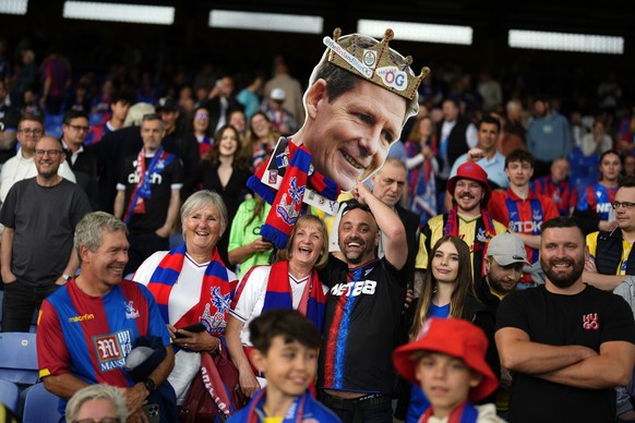 Crystal Palace fans hold up a cut out of manager Oliver Glasner ahead of the English Premier League soccer match between Crystal Palace and Wolverhampton Wanderers at Selhurst Park, London, Tuesday, M ...