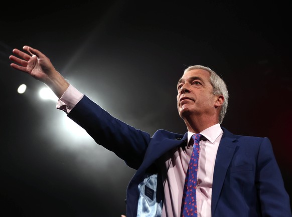 epa12357544 Reform UK Leader Nigel Farage gestures as he closes the conference on day two of the Reform UK annual conference in Birmingham, Britain, 06 September 2025. The Reform UK Conference 2025 to ...