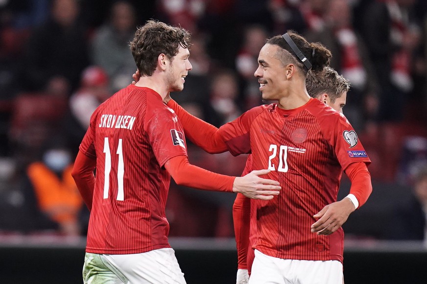 epa09579338 Denmark&#039;s Andreas Skov Olsen (11) celebrates scoring the 1-0 and is congratulated by Yussuf Poulsen (20) during the FIFA World Cup 2022 qualifier between Denmark - Faroe Islands in Co ...