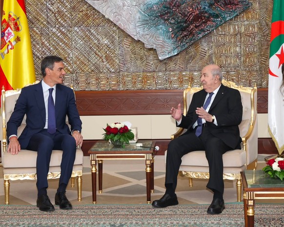 epa13122838 A handout photo made available by the Press service of the Algerian presidency shows Algerian President Abdelmadjid Tebboune (R) meeting with Spanish Prime Minister Pedro Sanchez at the pr ...