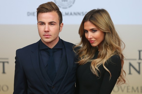 BERLIN, GERMANY - NOVEMBER 10: Mario Goetze and his girlfriend Ann-Kathrin Broemmel arrives for the movie premiere &#039;Die Mannschaft&#039; at Sony Center Berlin on November 10, 2014 in Berlin, Germ ...