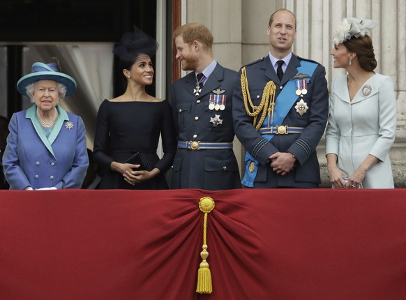 FILE - In this file photo dated Tuesday, July 10, 2018, Britain&#039;s Queen Elizabeth II, and from left, Meghan the Duchess of Sussex, Prince Harry, Prince William and Kate the Duchess of Cambridge,  ...