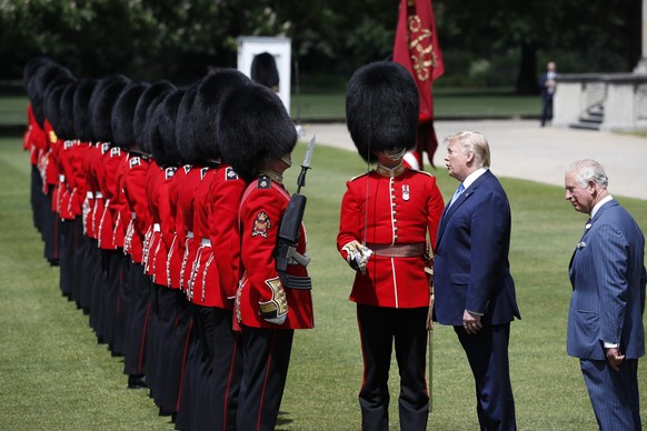 President Donald Trump and Prince Charles inspect the Guard of Honor at Buckingham Palace, Monday, June 3, 2019, in London. (AP Photo/Alex Brandon)