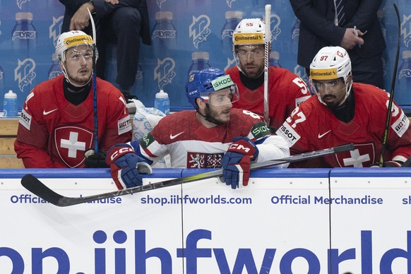 Czech Republic's Ondrej Beranek, center, reacts on Switzerland?s bench during the Ice Hockey World Championship final match between Switzerland and Czech Republic in Prague at the O2 Arena, Czech ...
