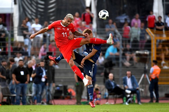 Switzerland&#039;s Valon Behrami, left, in action against Japan’s Keisuke Honda, right, during an international friendly soccer match in preparation for the upcoming 2018 Fifa World Cup in Russia betw ...