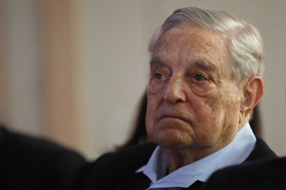 George Soros, Founder and Chairman of the Open Society Foundations listens to the conference after his speech entitled &quot;How to save the European Union&quot; as he attends the European Council On  ...