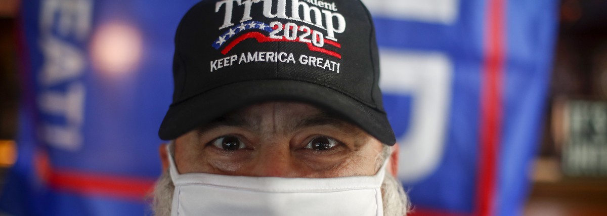 epa08797762 A Trump supporter poses for a photo at a bar during a Republicans in Thailand viewing party of the US election results, in Bangkok, Thailand, 04 November 2020. US citizens voted during the ...