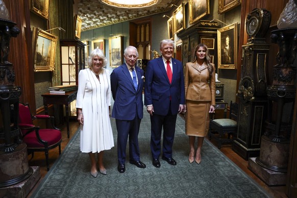 President Donald Trump and first lady Melania Trump, right, stand next to Britain's King Charles III and Queen Camilla as they bid their farewells during Donald Trump's departure from Windso ...