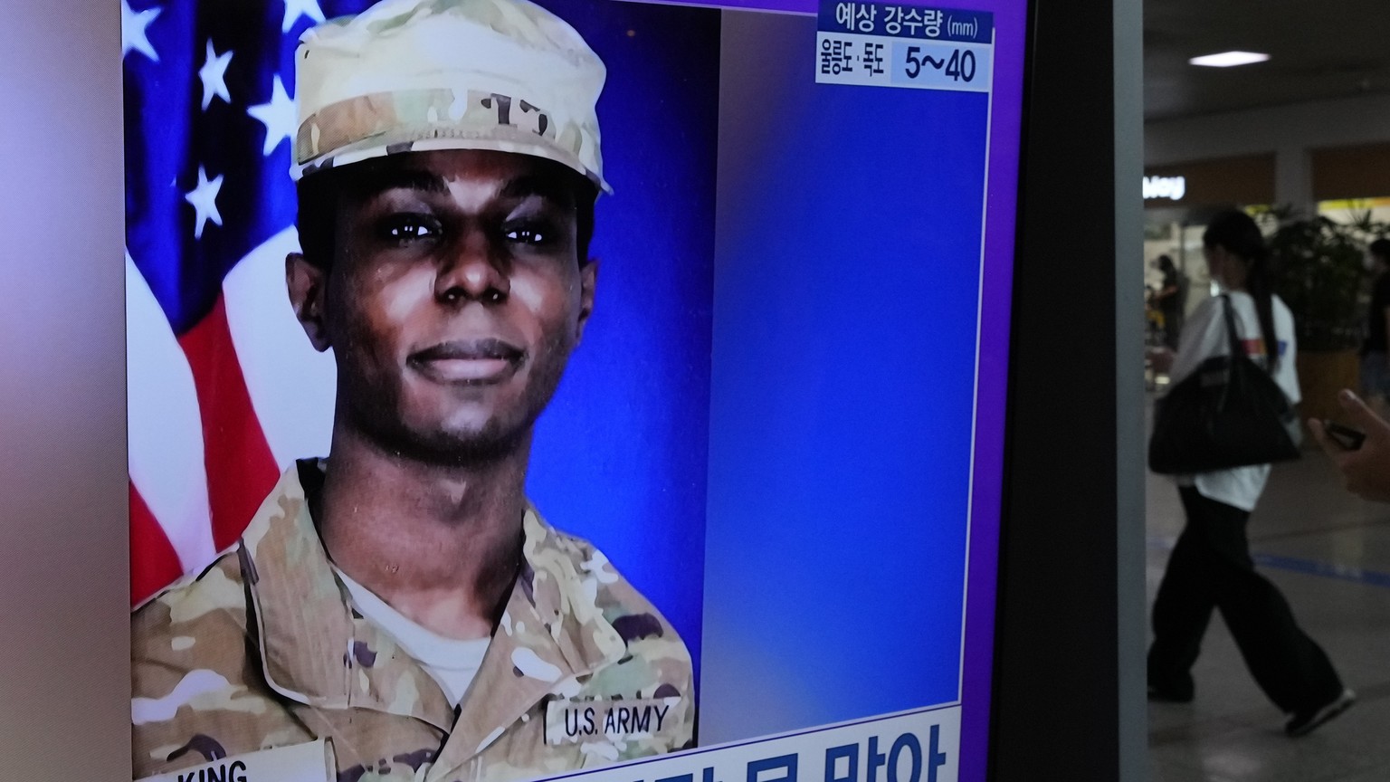 A TV screen shows a file image of American soldier Travis King during a news program at the Seoul Railway Station in Seoul, South Korea, Monday, July 24, 2023. The deputy commander of the U.N. Command ...