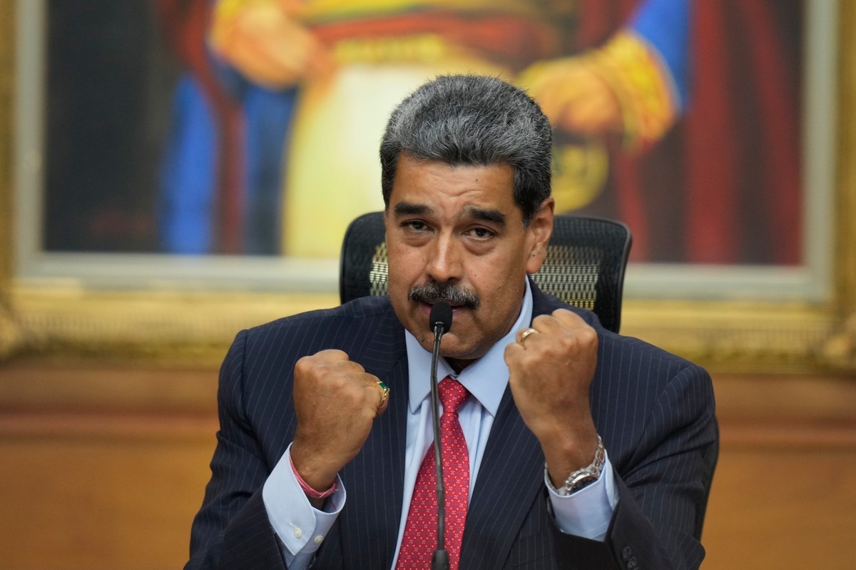 FILE - Venezuelan President Nicolas Maduro raises up his closed fists during a news conference at Miraflores presidential palace in Caracas, Venezuela, July 31, 2024, three days after his disputed ree ...