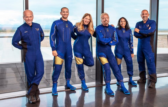 This image provided by Virgin Galactic shows, from left: Chief Pilot Dave Mackay, Lead Operations Engineer Colin Bennett, Chief Astronaut Instructor Beth Moses, Founder of Virgin Galactic Richard Bran ...