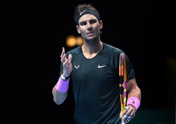 epa08834977 Rafael Nadal of Spain in action against Daniil Medvedev of Russia during their semi final match at the ATP World Tour Finals tennis tournament in London, Britain, 21 November 2020. EPA/AND ...