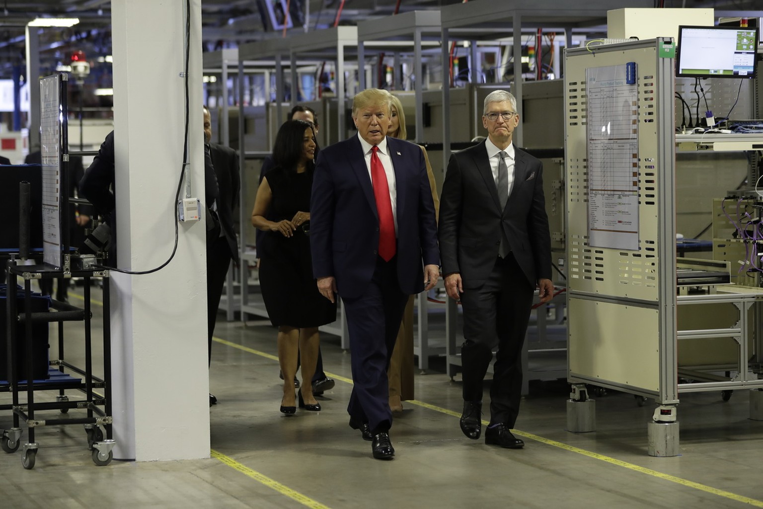President Donald Trump tours an Apple manufacturing plant, Wednesday, Nov. 20, 2019, in Austin with Apple CEO Tim Cook. (AP Photo/ Evan Vucci)