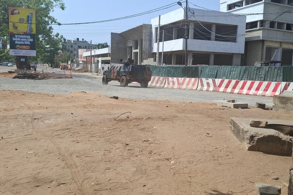 Soldiers ride in a military vehicle along a street amid an attempted coup in Cotonou Benin, Sunday Dec. 7, 2025. (AP Photo)
Benin Military Takeover
