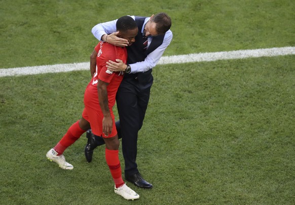 England head coach Gareth Southgate embraces England&#039;s Raheem Sterling after he was substituted during the quarterfinal match between Sweden and England at the 2018 soccer World Cup in the Samara ...