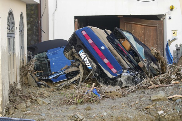 Cars covered in mud are seenr heavy rainfall triggered landslides that collapsed buildings and left as many as 12 people missing, in Casamicciola, on the southern Italian island of Ischia, Sunday, Nov ...