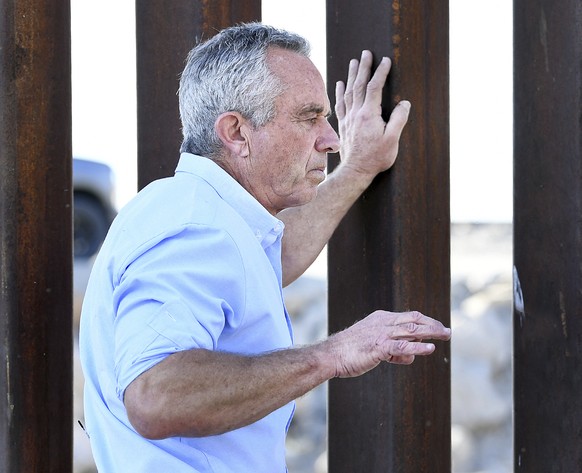 Democratic presidential candidate Robert F. Kennedy Jr. Robert F. Kennedy Jr. leans on the bollard wall along the United States-Mexico border in the area of County 13th Street and Yuma Levee Road whil ...
