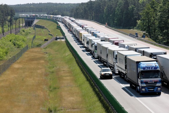 epa06755757 Trucks stuck in traffic during their way to Germany on the A2 highway near Rzepin, west Poland, 22 May 2018. The heavy traffic has caused a 40-km long traffic jam due to the trucks could n ...