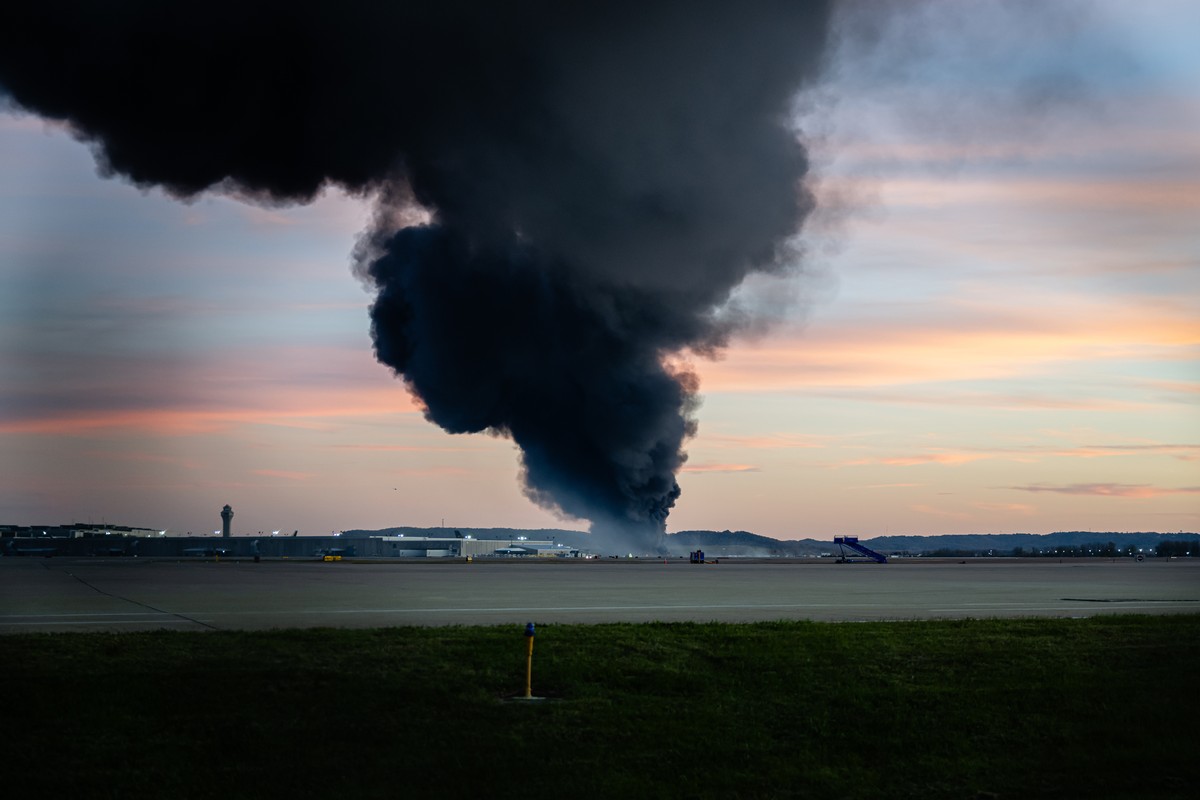 KEYPIX - A plume of smoke rises from the site of a UPS cargo plane crash at Louisville Muhammad Ali International Airport on Tuesday, Nov. 4, 2025, in Louisville, Ky. (AP Photo/Jon Cherry)