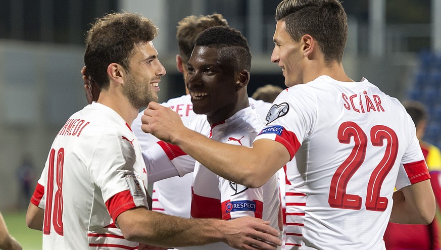 Switzerland&#039;s Admir Mehmedi, Breel Embolo and Fabian Schaer, from left, cheer after scoring during the 2018 Fifa World Cup Russia group B qualification soccer match between Andorra and Switzerlan ...