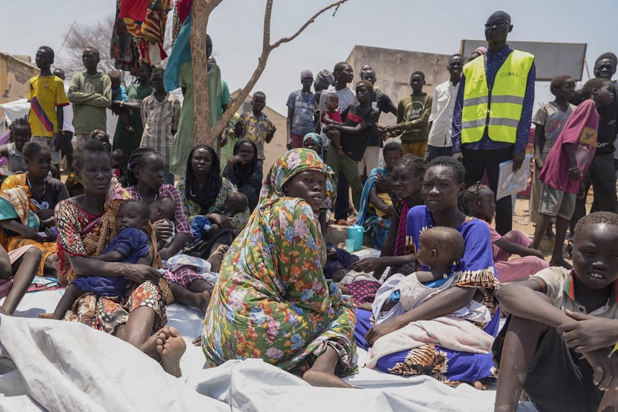 FILE - South Sudanese who fled from Sudan sit outside a nutrition clinic at a transit center in Renk, South Sudan, on May 16, 2023. Four Western countries have floated a proposal on Wednesday Oct. 4,  ...