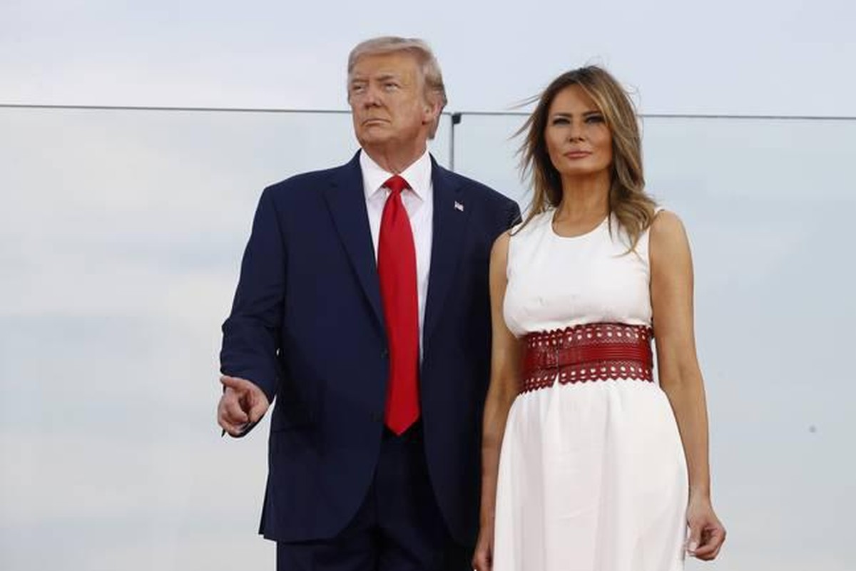 President Donald Trump and first lady Melania Trump stand onstage during a "Salute to America" event on the South Lawn of the White House, Saturday, July 4, 2020, in Washington. (AP Photo/Pa ...