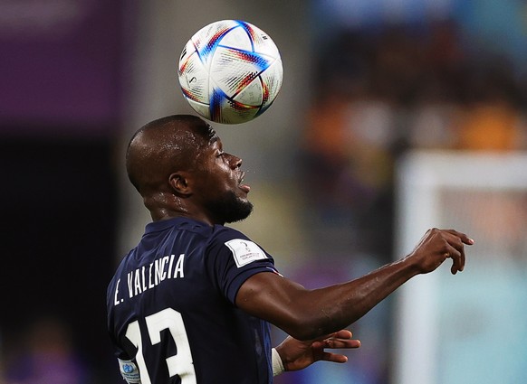 epa10328044 Enner Valencia of Ecuador in action during the FIFA World Cup 2022 group A soccer match between the Netherlands and Ecuador at Khalifa International Stadium in Doha, Qatar, 25 November 202 ...