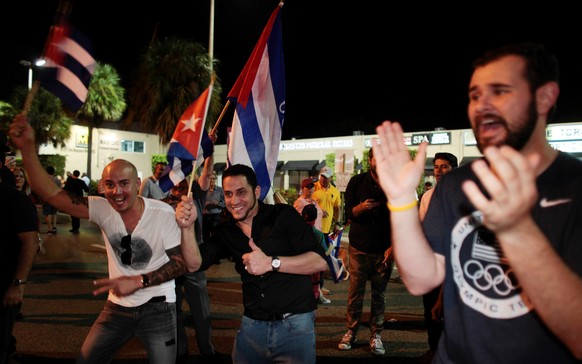 People celebrate after the announcement of the death of Cuban revolutionary leader Fidel Castro in the Little Havana district of Miami, Florida, U.S. November 26, 2016. REUTERS/Javier Galeano